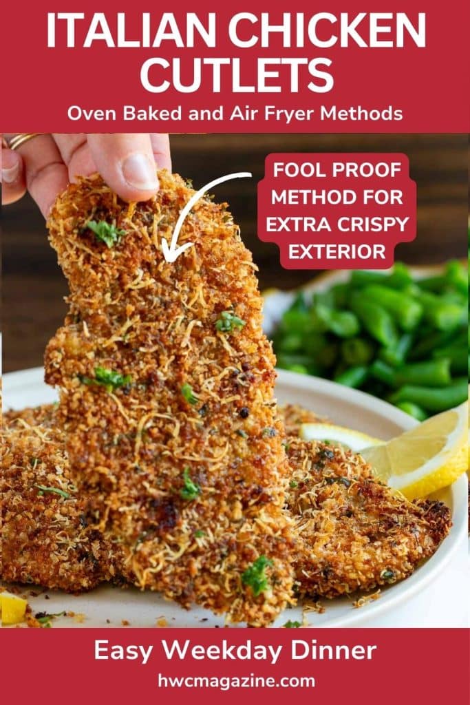 Baked Italian chicken cutlet held in fingers showing that extra crispy breading.