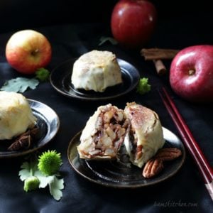 Apple mooncake cut in half showing the spiced apples.