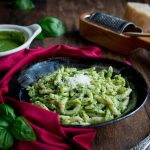 Trofie al pesto tossed in pesto and garnished with parmesan cheese.