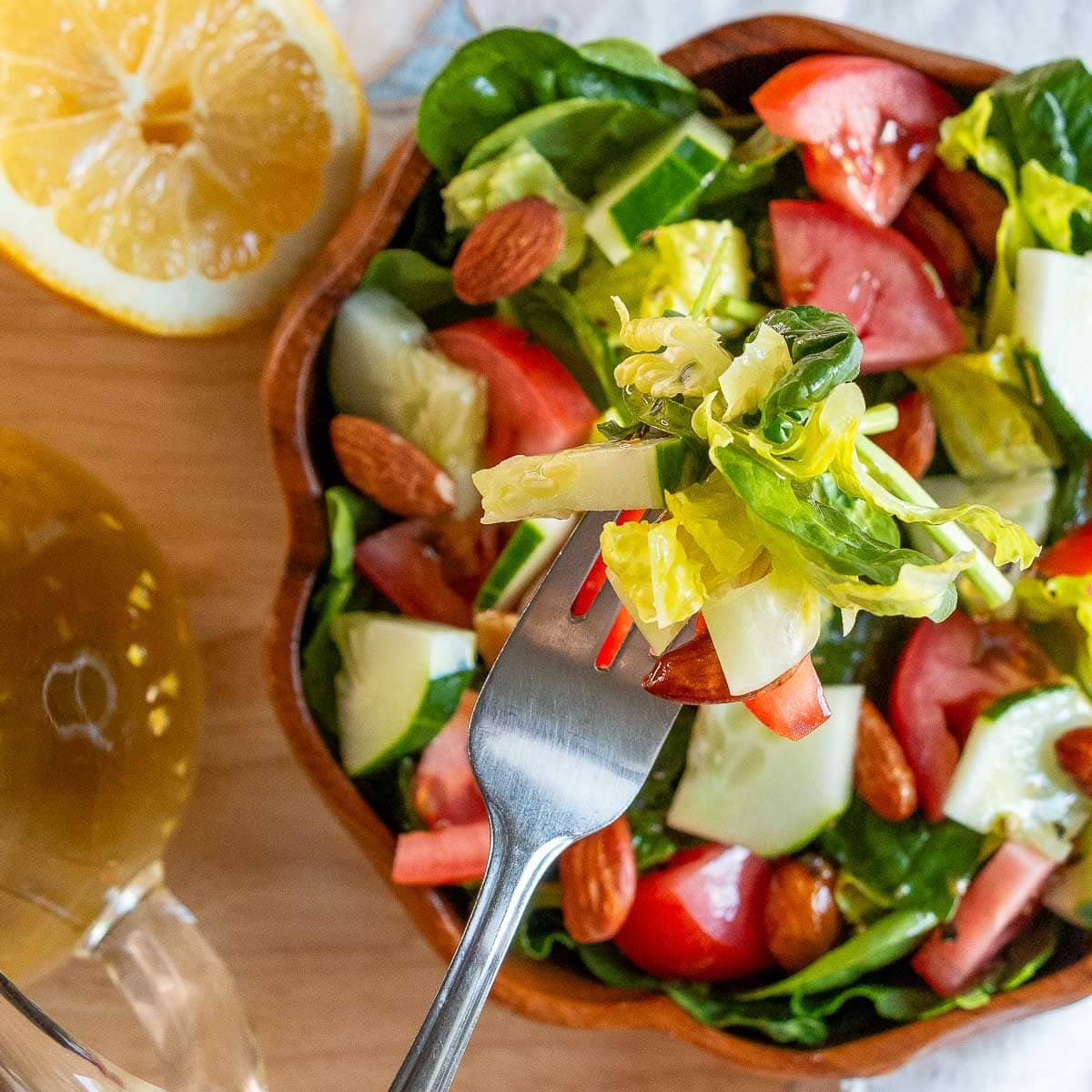 Bite of a fresh tossed salad with lemon dressing. 