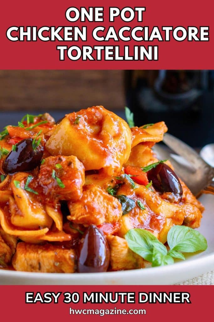 Saucy chicken cacciatore tortellini pasta with olives on a white plate.